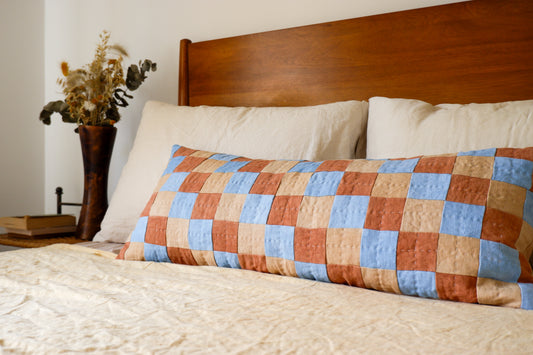 CHEQUERED CUSHION IN BLUE, TERRACOTTA AND CREAM
